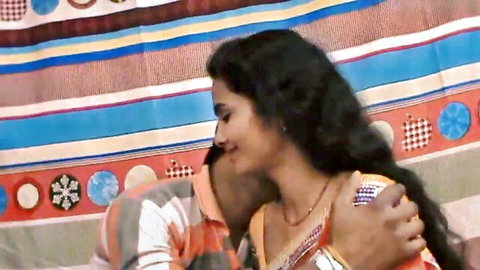 Sexy Indian woman with big tits passionately kissed on neck by lover in saree blouse