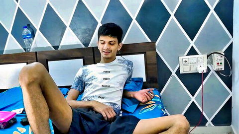 Young Indian stepbrother lounging on bed in t-shirt and shorts, hardcore stepsis sex preview