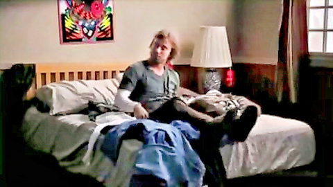 Shaggy lookalike in Scooby Doo XXX parody lounging on bed