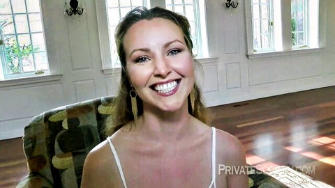Smiling blonde babe in thin white tank top teasing deep cleavage and perky tits