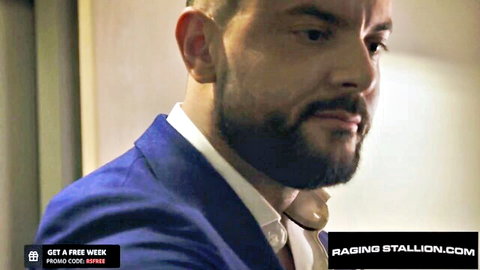 Suited Latino hunk with beard in blue suit, Raging Stallion gay porn preview