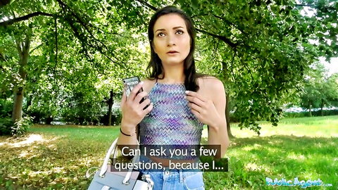 Lost Italian tourist in colorful halter top and jeans looking surprised outdoors