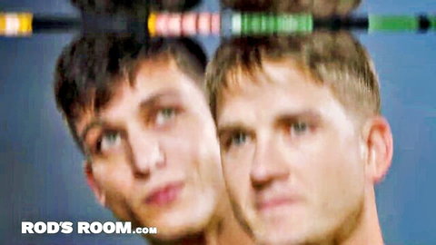 Two handsome young twinks staring intently with colorful stripper pole