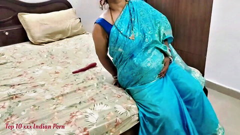Mature Indian stepmom in blue saree showing cleavage tease