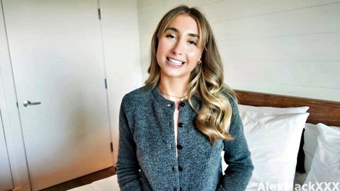 Lily Phillips smiling in gray cardigan, blonde tease for Russian creampie