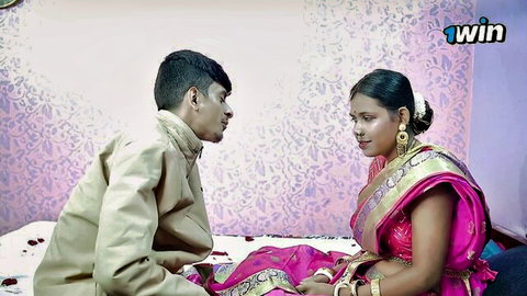 Beautiful Indian girl in pink saree with boyfriend, intimate couple moment
