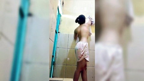 Topless Clarissa in pink shorts bends over in viral hijab tease bathroom scene