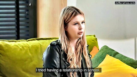 Blonde teen in leather jacket on casting couch interview about school relationships