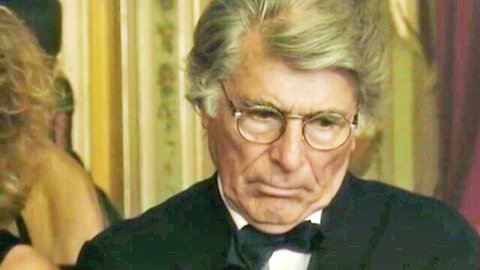 Mature Italian man in tuxedo with serious gaze, elegant casino classic scene