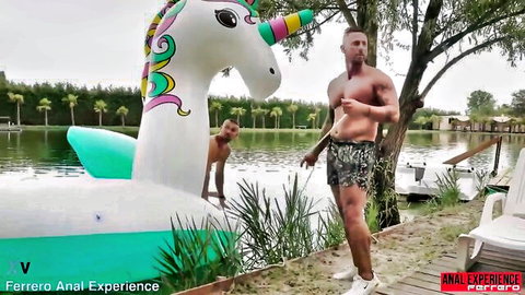 Muscular guys near unicorn floatie at lake in Italian MILF 3-cock gangbang scene