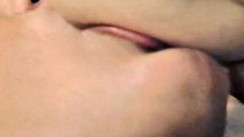 Blonde woman's glossy pink lips parted wide for cock sucking blowjob closeup