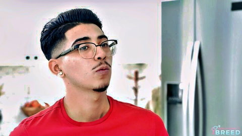 Young Latino guy in glasses and red shirt for mom breeding scene
