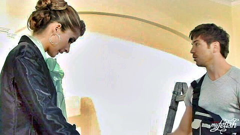 Nessa Devil as bride in blazer inspects painter's work