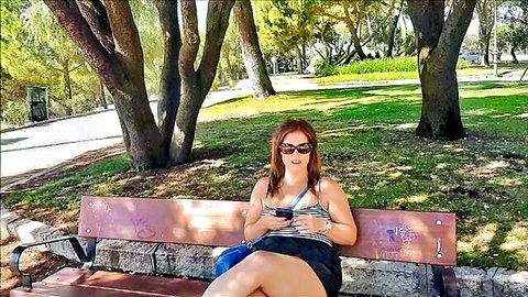 Montse Swinger in short skirt and tank top on park bench, legs spread teasingly