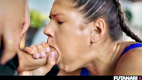 Close-up of trans woman with fingers in mouth, braided hair, blue top