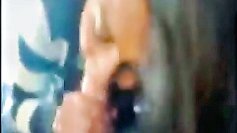 Brunette babe with big tits gripping and sucking thick cock in rough blowjob.