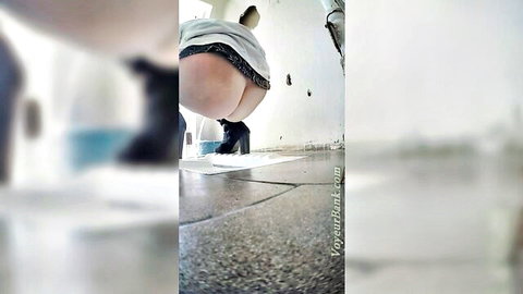 Chunky white brunette bends over in public ladies restroom, upskirt ass view