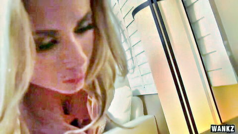 Blonde MILF purses plump lips in sensual close-up teasing blowjob.