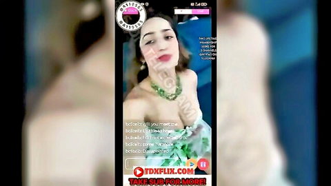 Desi babe in green lingerie seductively sucks glossy finger teasing on webcam