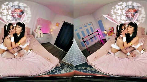 Two sexy Asian bunny girls in skimpy lingerie passionately kissing and groping tits on pink furry bed