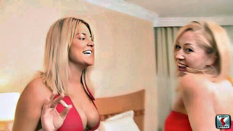 Two busty blondes in red dresses smiling seductively in Mofos scene