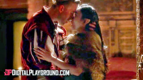 Passionate embrace and kiss between bearded man in red jacket and brunette in fur wrap