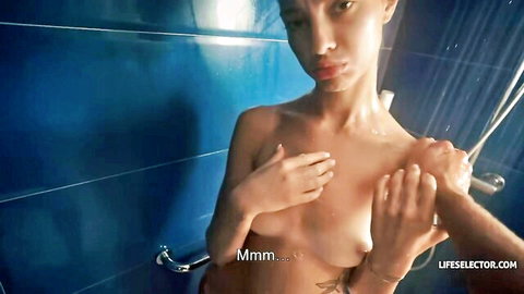 Nude Asian stepsis in steamy shower, wet body caressed by hand
