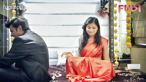 Desi BBW in red saree seducing suited Indian man on bed