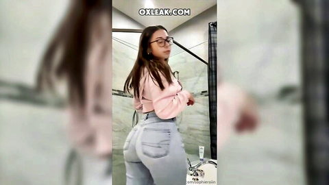 Sophie Rain teasing with big ass in tight jeans, bathroom twerk pose