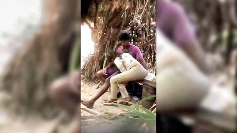 Sri Lankan couple intimately grinding clothed in beach hut outdoor tease