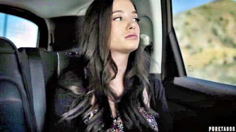 Gia Paige looks thoughtful in car backseat during scenic drive