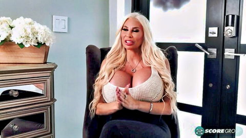 Busty blonde Barbie Nicole in deep cleavage top for SCORE interview