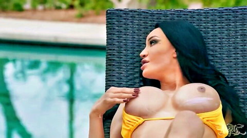 Gorgeous trans Kimberlee applies sun lotion on her huge tits by the pool