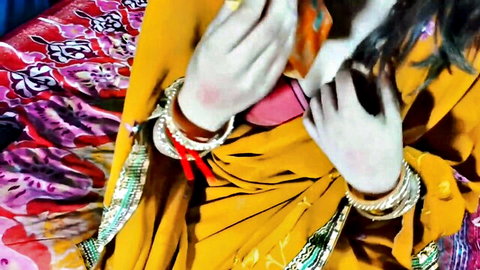 Indian bhabhi in yellow saree with bangles and red accents, teasing desi hookup