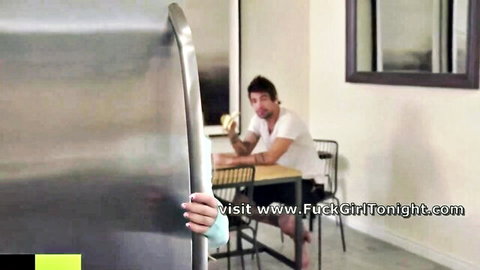 Stepsister peeking hand from fridge teasing tattooed stepbrother in kitchen