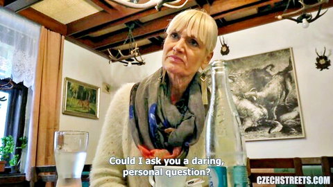 Blonde mature Czech tour guide in sweater and scarf asking personal question