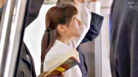 Japanese office woman in white blouse holding book in crowded elevator with suited men