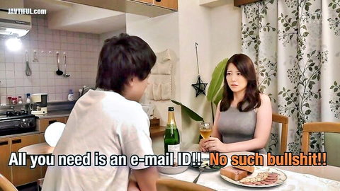 Clothed long-haired Japanese woman chats with man over champagne and food at kitchen table