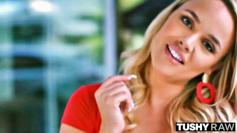 Stunning blonde bombshell in red top smiling in Tushy Raw compilation