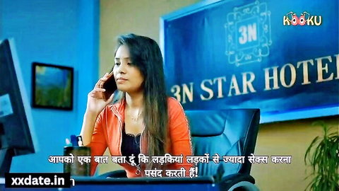 Sexy Indian bhabhi in orange top talking on phone in office