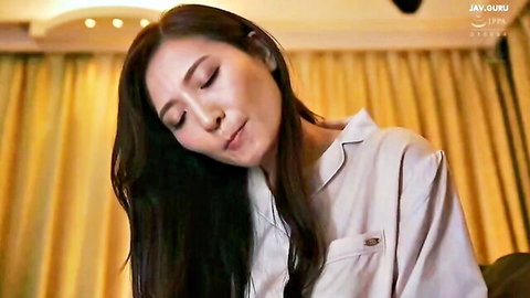 Seductive Asian MILF in pajama shirt turns head with parted lips closeup
