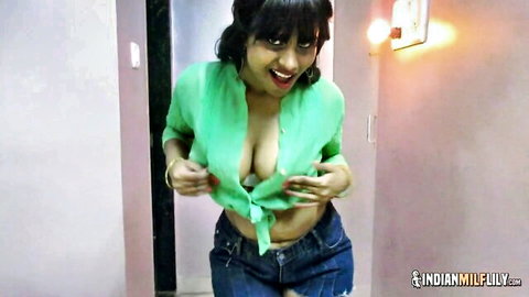 Horny Indian MILF with big boobs teasing in open green blouse