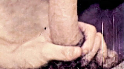 Vintage close-up of passionate nude embrace in O.Z. Films XXX scene