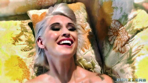 Kleio Valentien smiling seductively in Brazzers bedroom scene