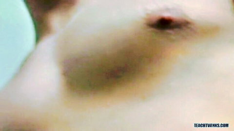 Close-up of erect nipple on smooth pale breast in steamy trans sex scene