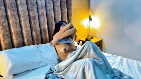 Saraymike exposing perky tits in bed, teasing nude
