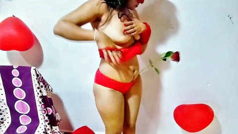 Seductive Indian bhabhi in red lingerie teasing breasts romantically