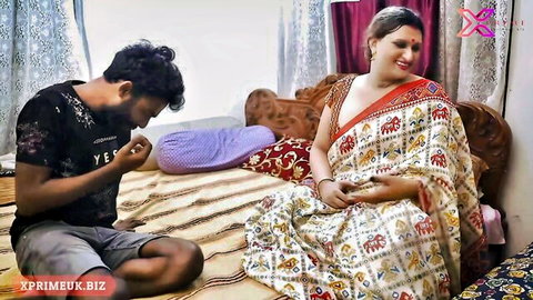 Gorgeous Indian beauty in white saree teased by kneeling young man