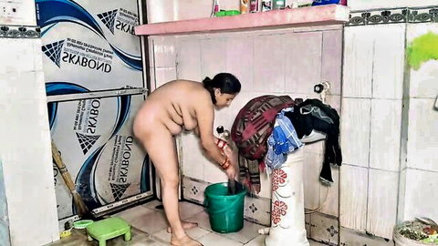 Nude Indian model Puja bending over washing clothes in explicit pose
