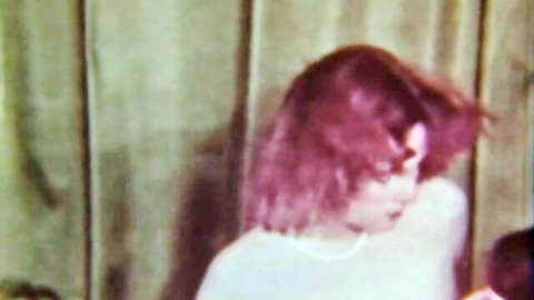Vintage redhead woman in white dress, intimate side profile from O.Z. Films 76